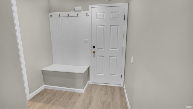 mudroom with baseboards and light wood finished floors