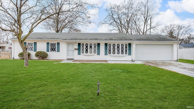 ranch-style house with a front yard, concrete driveway, and an attached garage