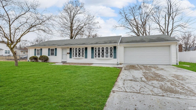 single story home featuring an attached garage, driveway, fence, and a front lawn