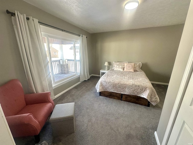 carpeted bedroom featuring a textured ceiling and baseboards