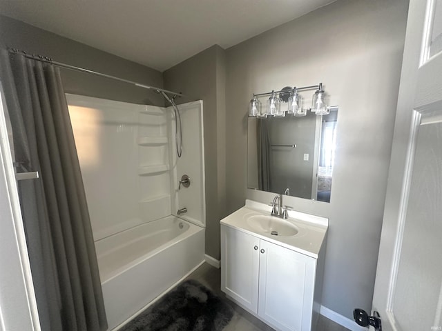 full bathroom with bathtub / shower combination, baseboards, and vanity