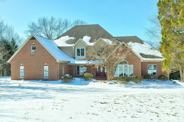 traditional-style house featuring brick siding