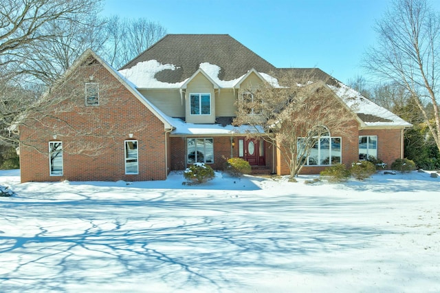 traditional-style home featuring brick siding