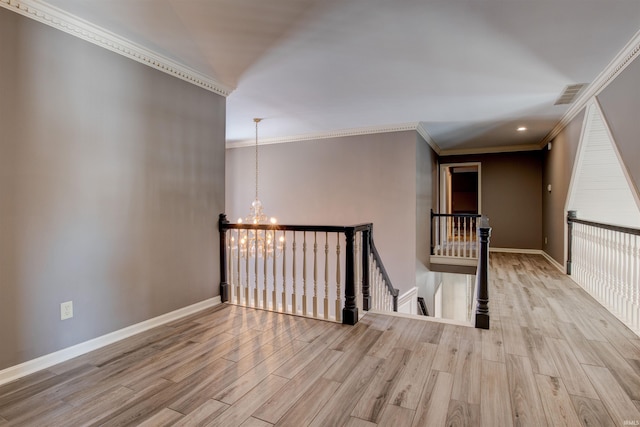 interior space featuring a chandelier, baseboards, visible vents, and light wood-style floors