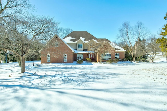 traditional-style home featuring brick siding