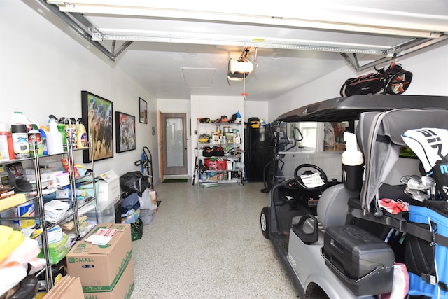 garage with freestanding refrigerator and a garage door opener