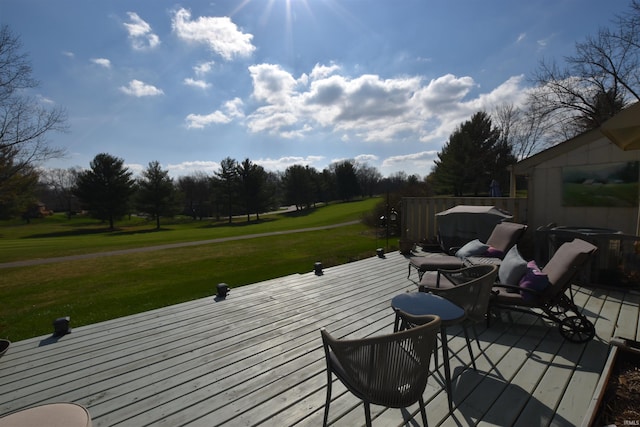 wooden deck with cooling unit and a lawn