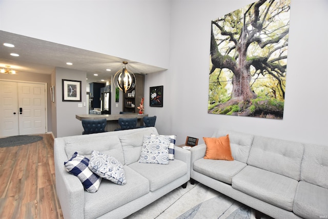 living room with recessed lighting and wood finished floors