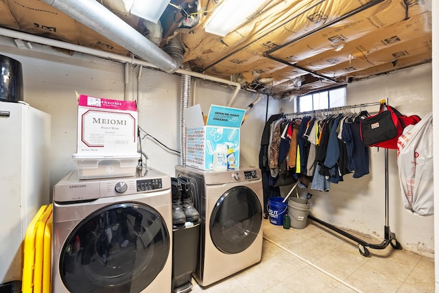 washroom with laundry area and washer and dryer