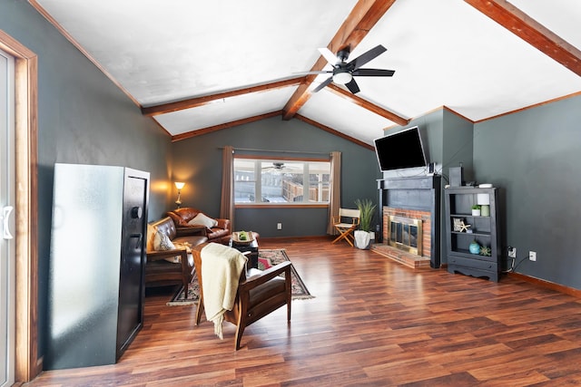 living area featuring vaulted ceiling with beams, ceiling fan, a fireplace, baseboards, and dark wood finished floors