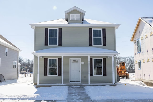 traditional style home featuring covered porch