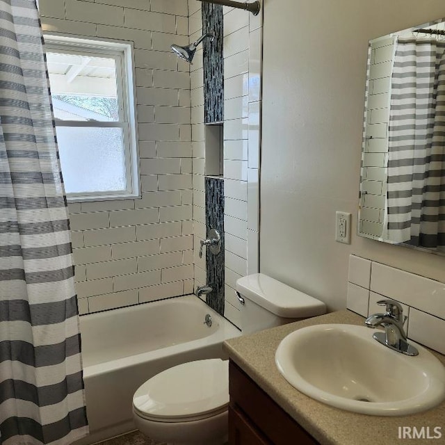 bathroom with shower / tub combo, vanity, and toilet