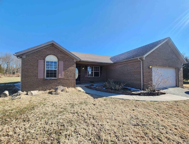 ranch-style house featuring brick siding and an attached garage