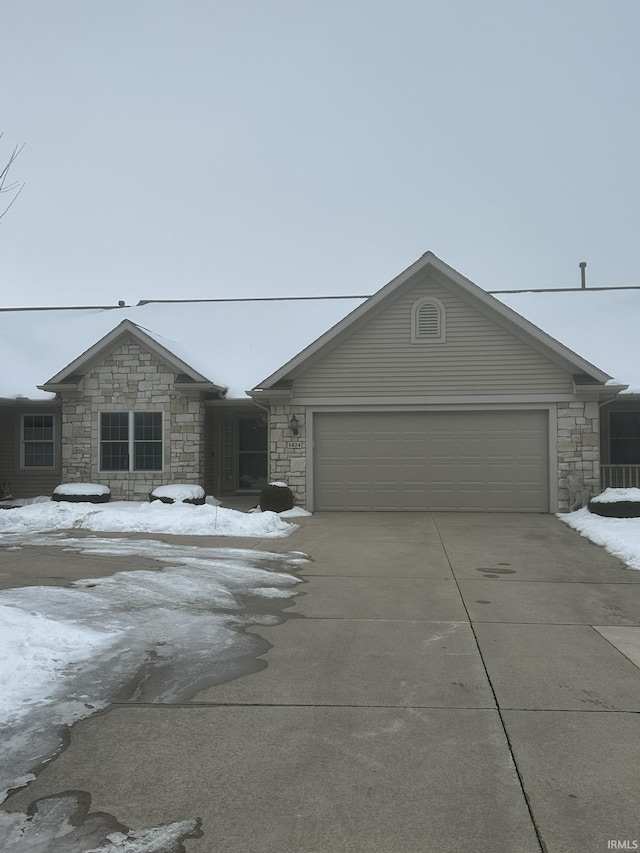 view of front facade with driveway and an attached garage