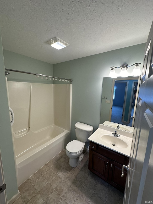 full bathroom featuring shower / tub combination, vanity, toilet, and a textured ceiling