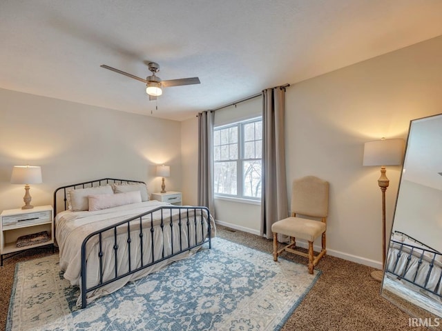 bedroom with carpet floors, ceiling fan, and baseboards