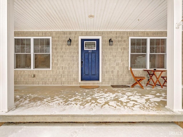 property entrance featuring covered porch