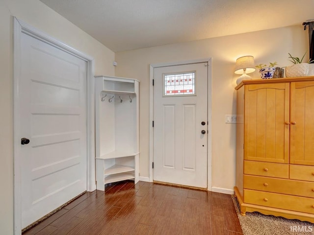 mudroom featuring wood finished floors and baseboards