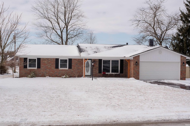 single story home featuring brick siding and an attached garage