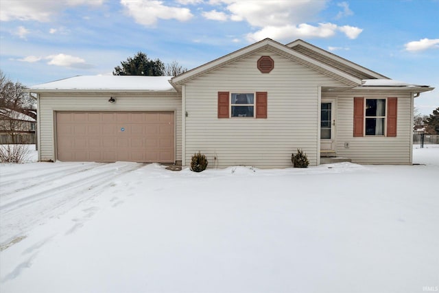 ranch-style home with entry steps and an attached garage