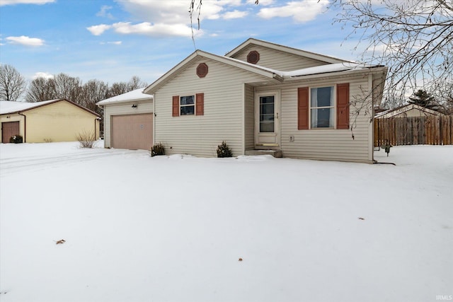 ranch-style home featuring entry steps and an attached garage