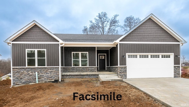 craftsman-style house featuring an attached garage, stone siding, and driveway