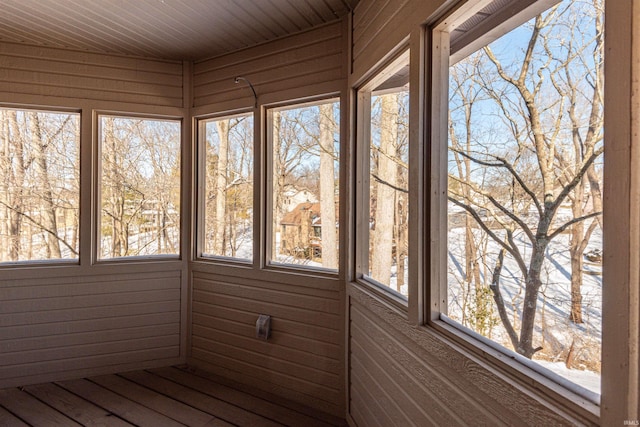 unfurnished sunroom featuring a wealth of natural light