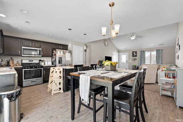 dining area featuring lofted ceiling, recessed lighting, visible vents, and light wood-style floors