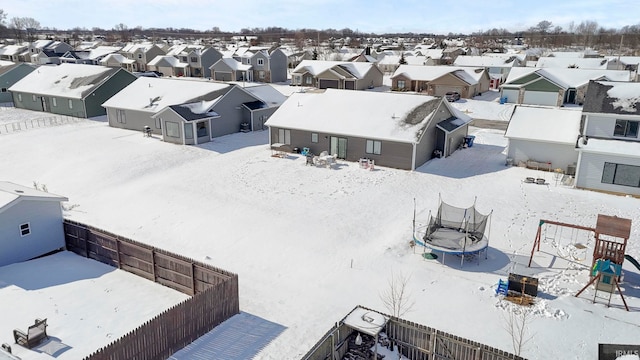 snowy aerial view with a residential view