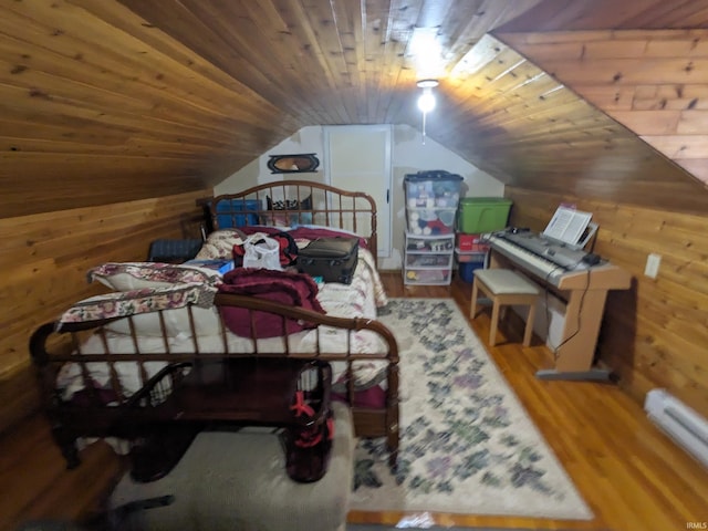 bedroom with wood ceiling, vaulted ceiling, wooden walls, and wood finished floors