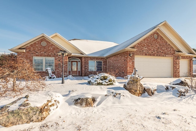 ranch-style house with a garage and brick siding