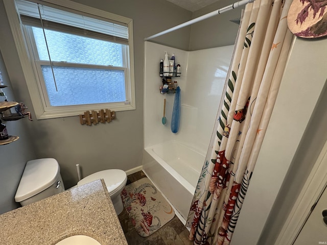 bathroom with shower / tub combo, toilet, and baseboards