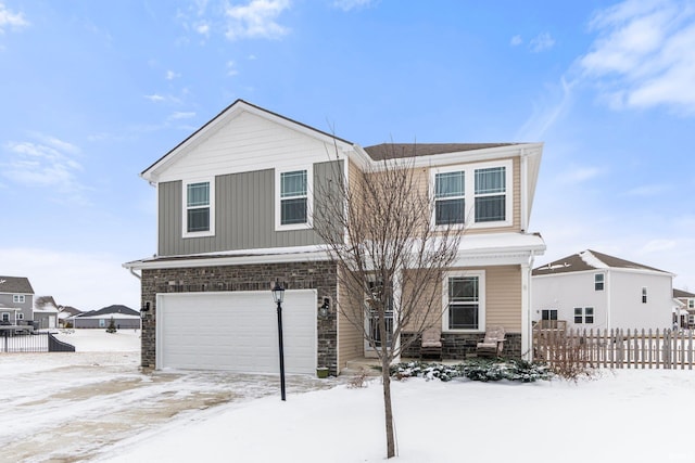 view of front of property with a garage and fence