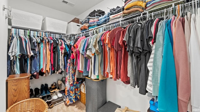 walk in closet with carpet floors and visible vents