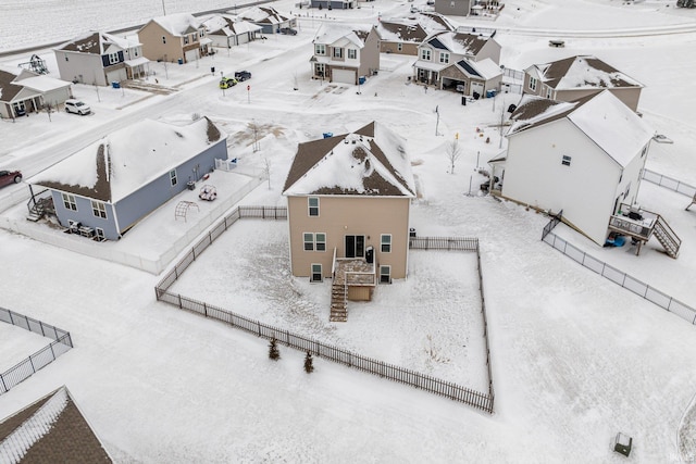 snowy aerial view with a residential view