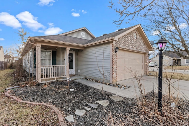 ranch-style house featuring an attached garage, a porch, concrete driveway, and brick siding