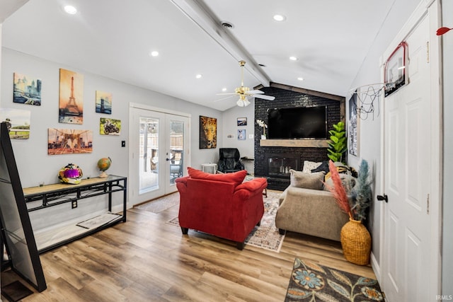 living room featuring a ceiling fan, lofted ceiling with beams, wood finished floors, french doors, and recessed lighting