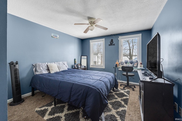 bedroom featuring carpet flooring, ceiling fan, a textured ceiling, and baseboards