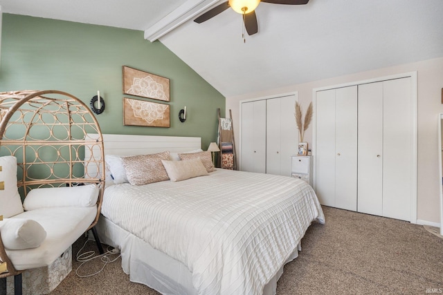 bedroom with vaulted ceiling with beams, carpet floors, ceiling fan, and multiple closets