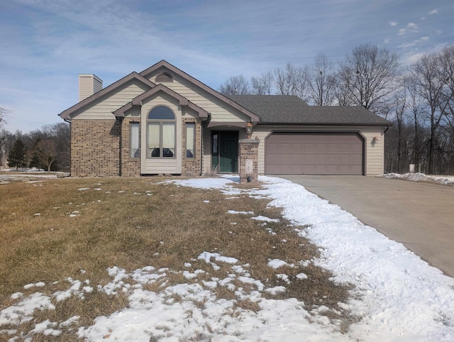 view of front facade featuring an attached garage, a chimney, concrete driveway, and brick siding