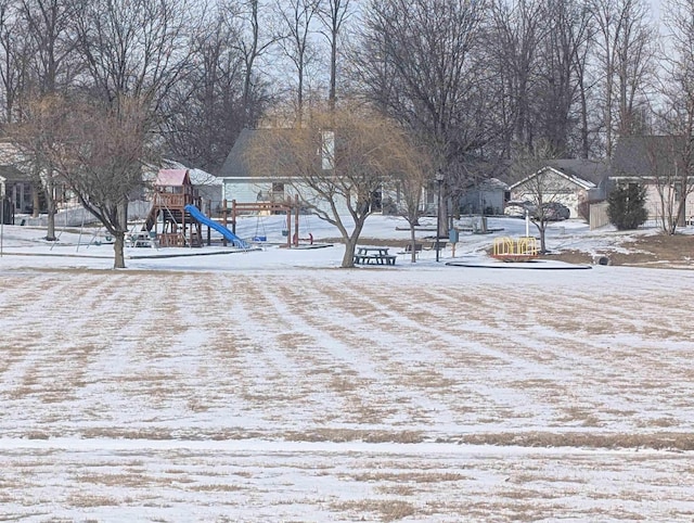 yard covered in snow featuring playground community