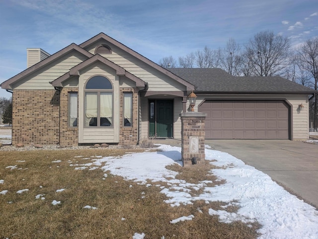 ranch-style house featuring brick siding, driveway, a chimney, and an attached garage