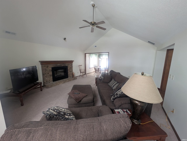 living room with light carpet, a fireplace, lofted ceiling, and visible vents