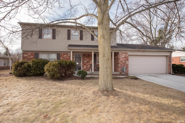 traditional-style house with an attached garage, driveway, a front yard, and brick siding