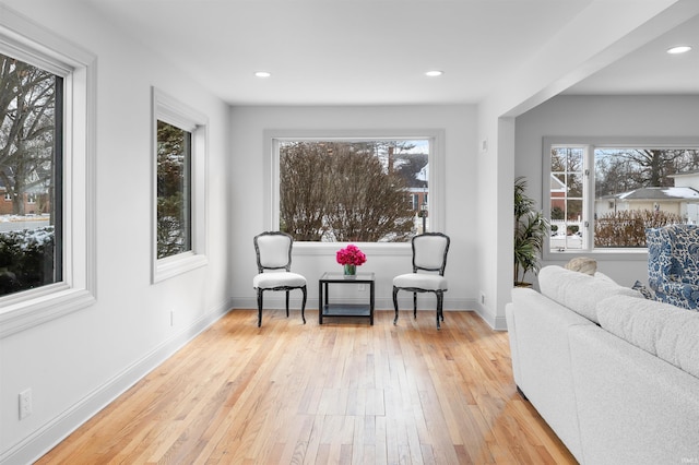 sitting room featuring light wood-style floors, baseboards, and recessed lighting