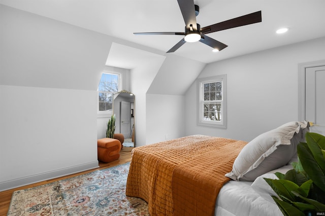 bedroom featuring vaulted ceiling, wood finished floors, a ceiling fan, and recessed lighting