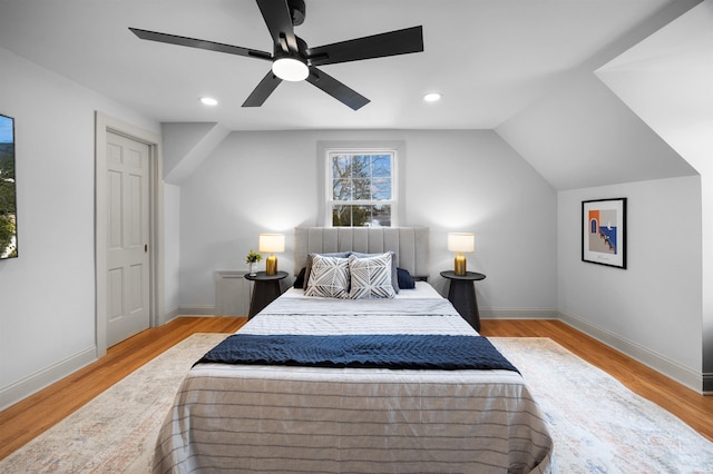 bedroom with baseboards, ceiling fan, vaulted ceiling, light wood-style floors, and recessed lighting