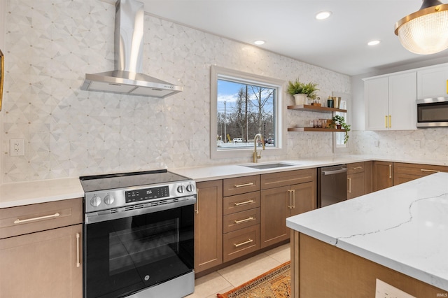 kitchen featuring appliances with stainless steel finishes, wall chimney range hood, open shelves, a sink, and light tile patterned flooring