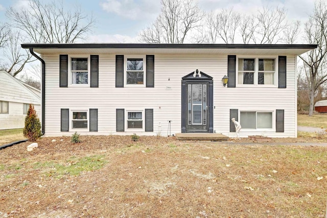 raised ranch featuring a front yard