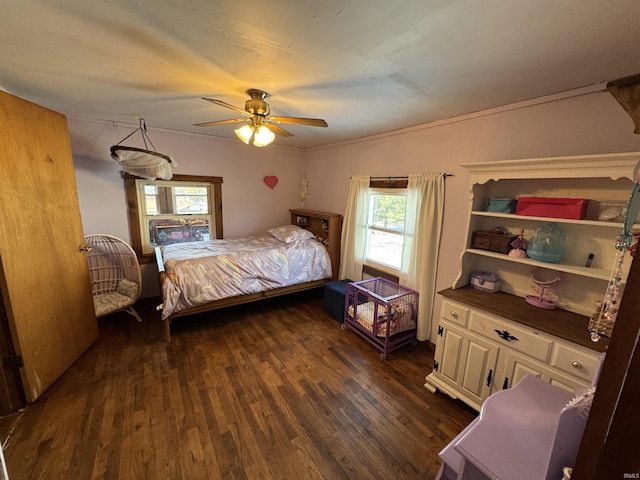 bedroom with a ceiling fan and dark wood-style flooring